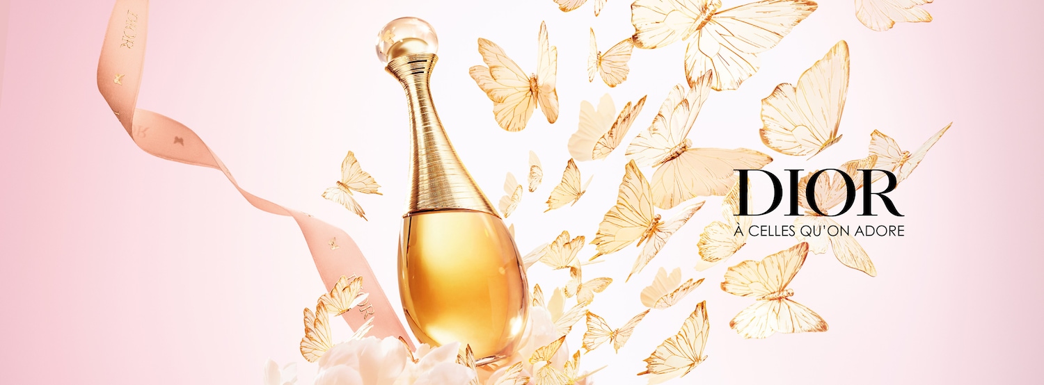 Découvrez J'adore de Dior, un parfum floral et lumineux, présenté dans un flacon doré élégant, entouré de papillons délicats, pour celles qu'on adore.