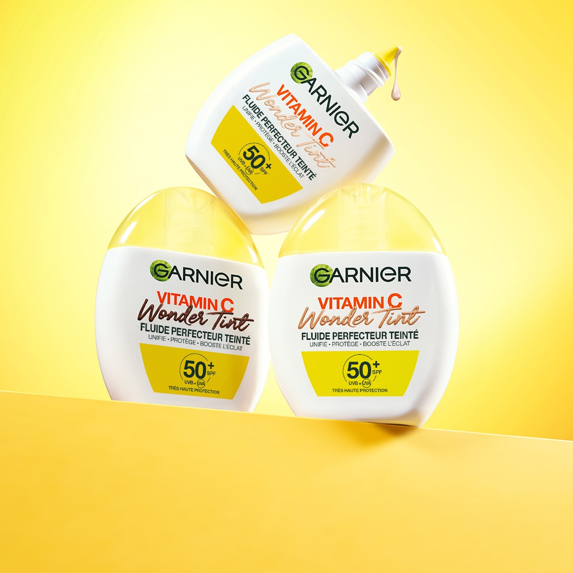 Découvrez le Fluide Perfecteur Teinté Vitamin C Wonder Tint de Garnier, qui unifie, protège et booste l'éclat de votre peau avec une très haute protection SPF 50+.