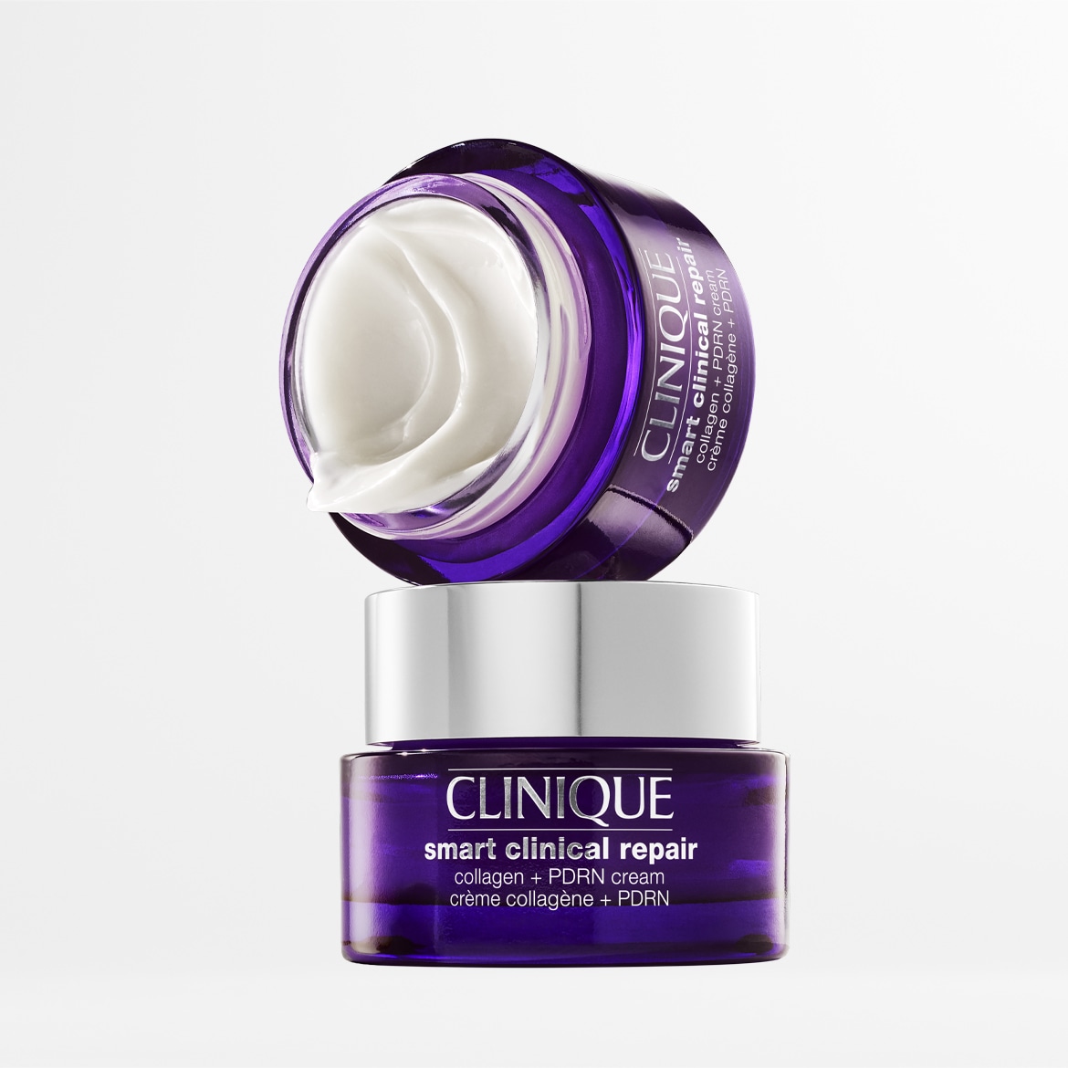 Découvrez la crème CLINIQUE Smart Clinical Repair Collagen + PDRN, un soin anti-âge puissant dans un pot violet élégant, avec une texture riche et crémeuse pour une peau visiblement réparée et rajeunie.