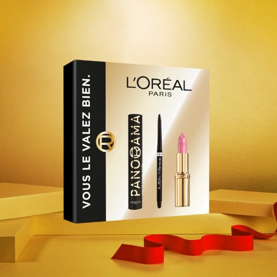 Découvrez le coffret L'Oréal Paris, comprenant le mascara Panorama, un crayon pour les yeux et un rouge à lèvres rose, le tout présenté dans un élégant emballage doré.