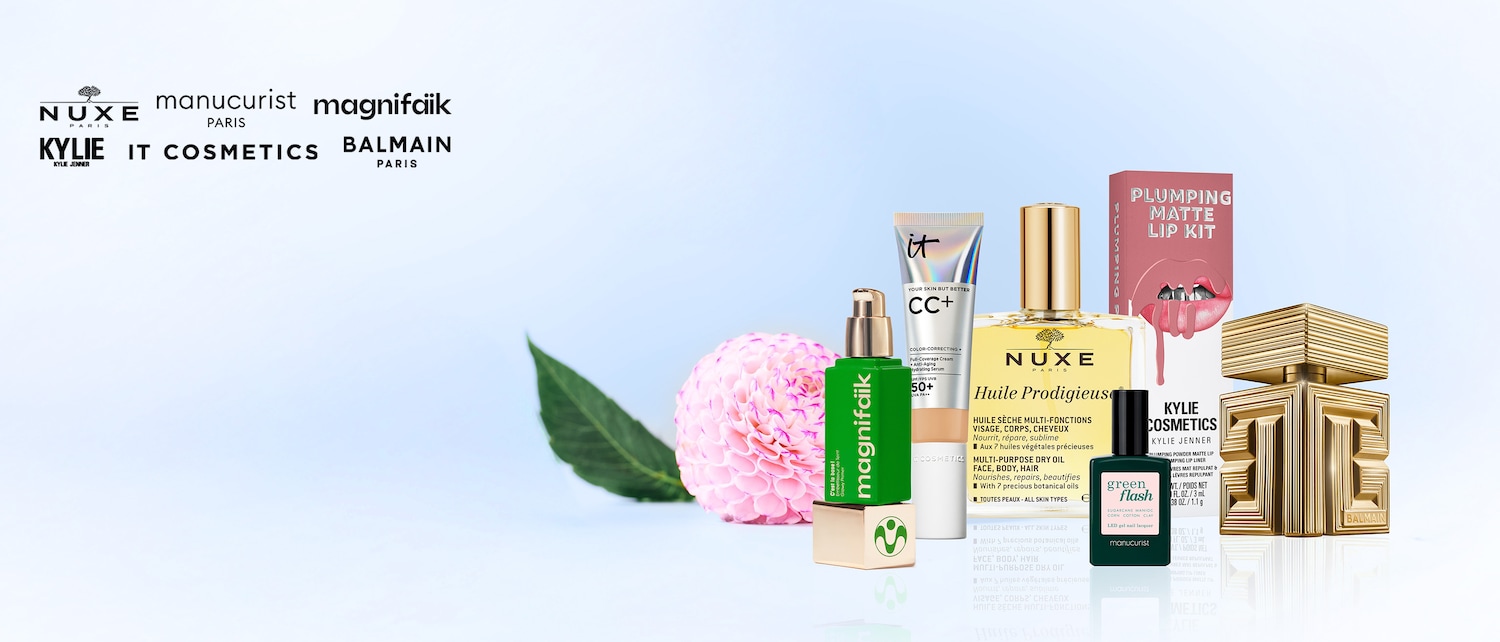 Découvrez une sélection de produits de beauté de marques renommées telles que Nuxe, Manucurist, Magnifaïk, Kylie Cosmetics, IT Cosmetics et Balmain, présentés avec une fleur rose et une feuille verte.