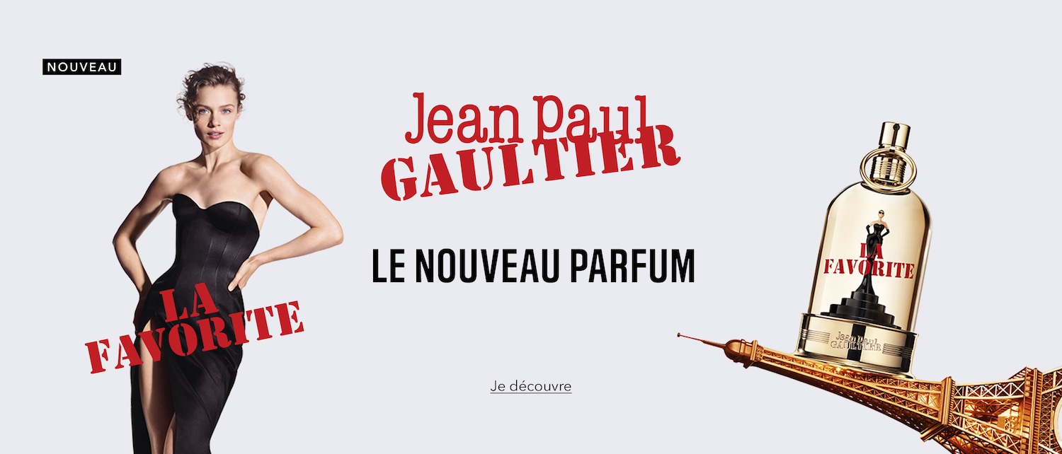 Découvrez le nouveau parfum Jean Paul Gaultier, La Favorite, avec une femme élégante en robe noire et le flacon doré posé sur la Tour Eiffel.