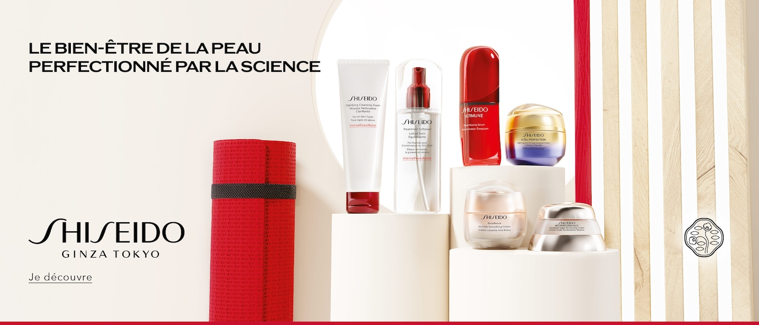Découvrez la gamme de soins Shiseido, comprenant des nettoyants, des lotions, des sérums et des crèmes, présentés dans des emballages élégants aux couleurs rouge, blanc, or et argent.