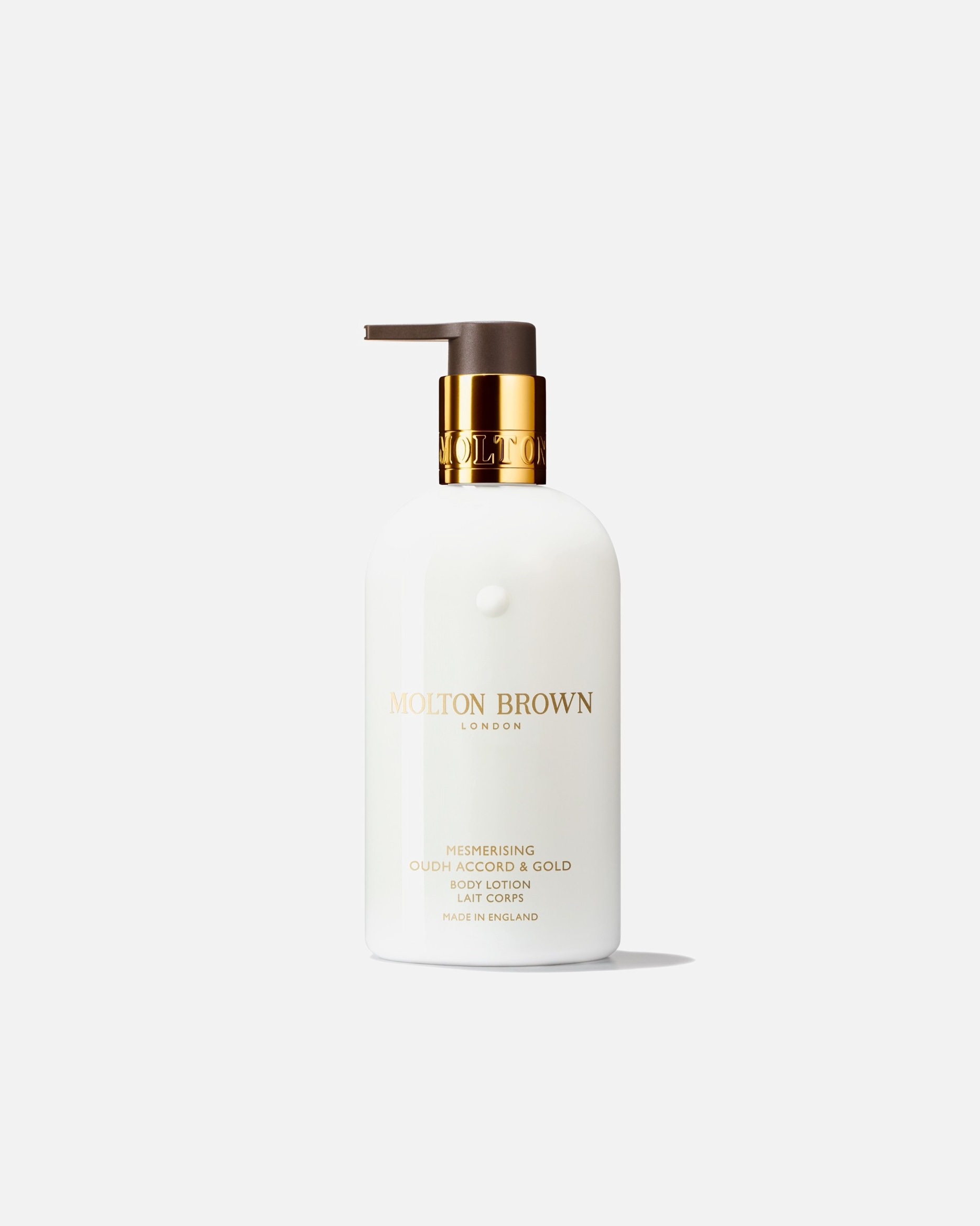 Crème pour les mains pour Unisexe Molton Brown Hand Care Mesmerising Oudh Accord & Gold Hand Lotion 300 ml